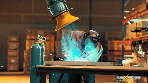 Fume arm attached to a portable fume extractor removing fumes and smoke from a metalworking project at Liftmoore.