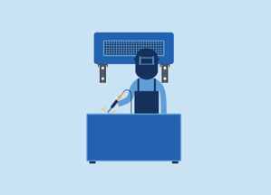 Machine operator working while an ambient air cleaner works behind him.