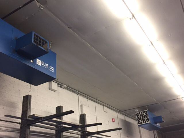 OX3500C ambient air cleaners installed above CNC machines at Smith Productions machine shop.