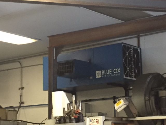 Ceiling-mounted OX3500C air cleaner with T-Style airflow filtering machine shop air