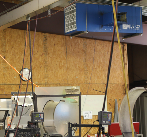 OX3500C air cleaner with T-Style airflow and silencer in an industrial machining facility